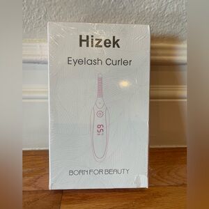 New in sealed box Hizek heated eyelash curler
